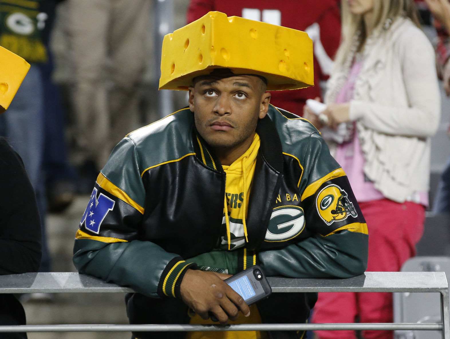 Packers fan in cheesehead hat, AP photo